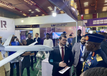 Milkor's Business Development Manager Julian Gardner presenting the Milkor 380 drone to the Nigerian Air Force Chief of Air Staff Air Marshal Hasan Bala Abubakar.